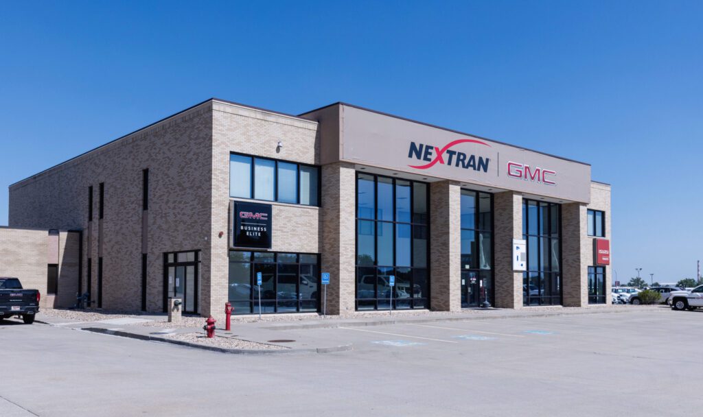 Featured Location Image - Exterior view of Nextran GMC dealership building in Kansas City